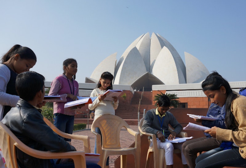 children in front of Lotus temple in India