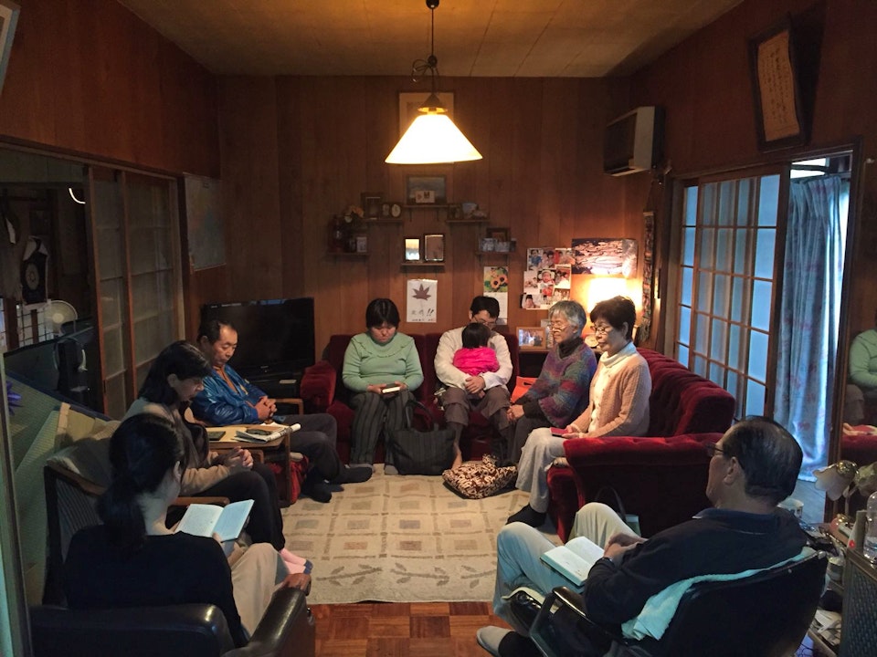 Praying together in the community of Nakagawa, Japan